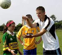 John McKeever coaches children at Creggan Cul Camp