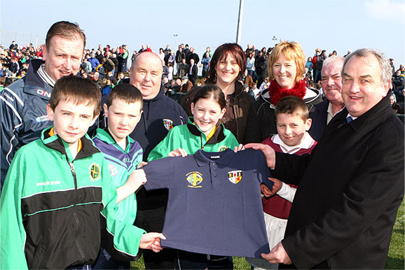 Cumann na mBunscol ball-boys and girls are presented with polo shirts by Nickey Brennan, along with County Chairman John McSparran and Youth Officer Tony McCollum.