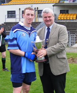 Glanarm Captain Brendan McDermott receives the cup.